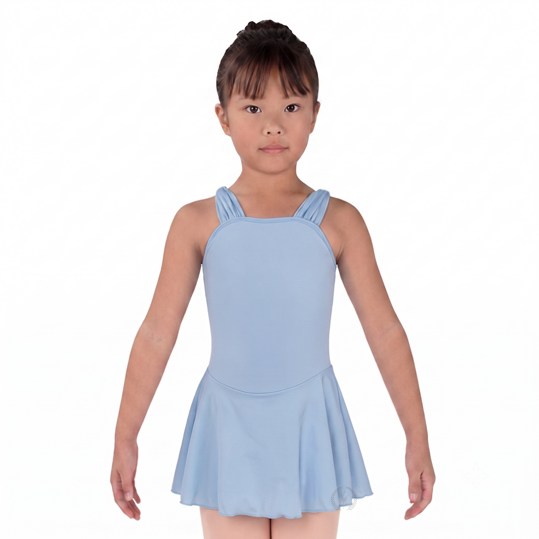 Young girl wearing a light blue dress on a white background