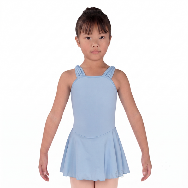Young girl wearing a light blue dress on a white background