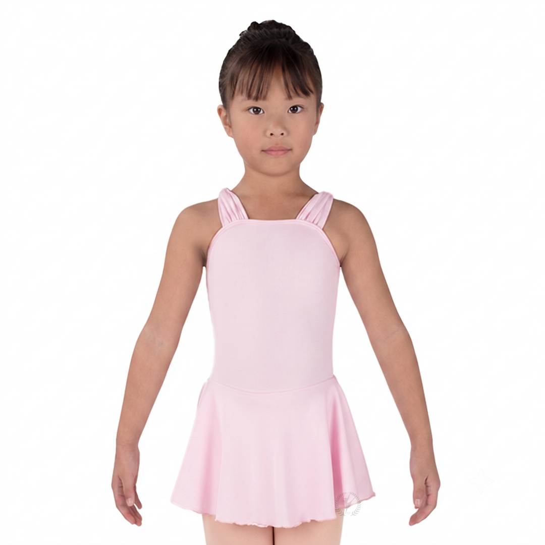 Young girl wearing a pink dress on a white background