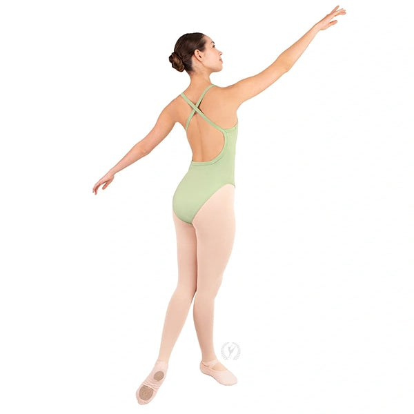 Dancer in a green leotard posing on a white background