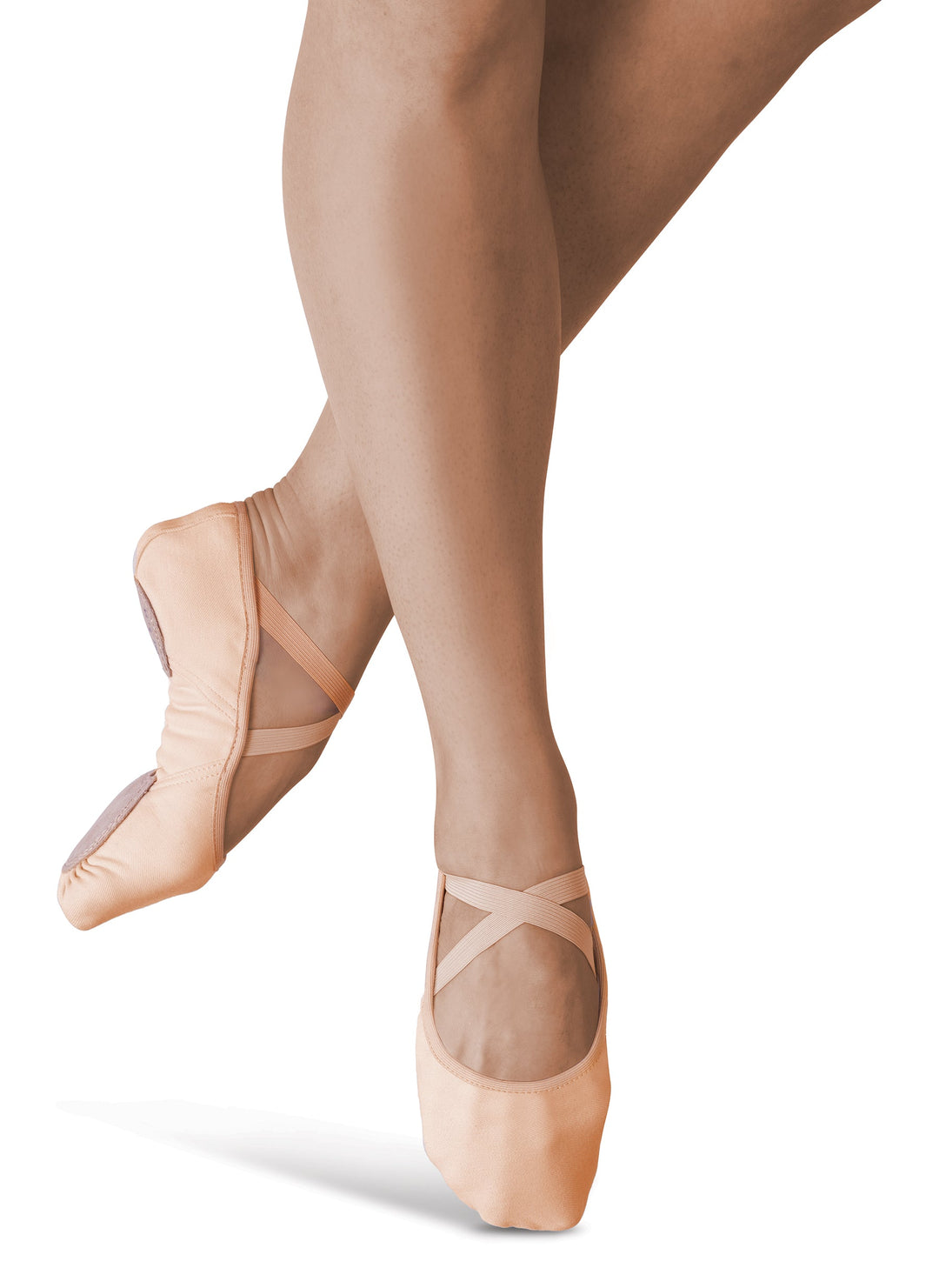 Ballet shoes worn with sheer tights on a white background