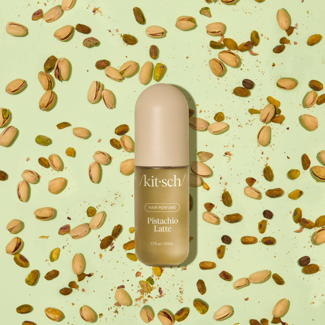 Kit-sch Pistachio Latte hair perfume bottle on a background with pistachios