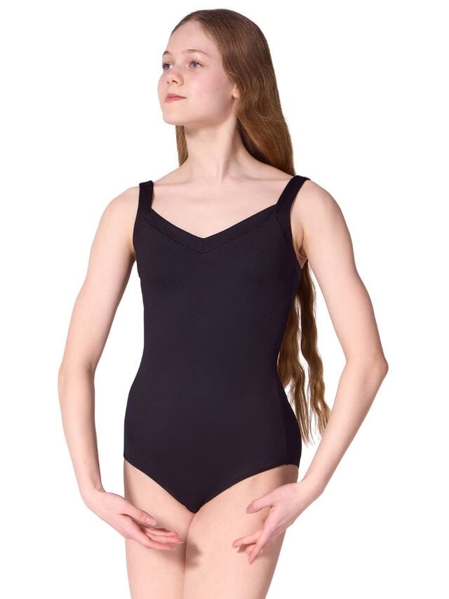Young girl wearing a black leotard on a white background