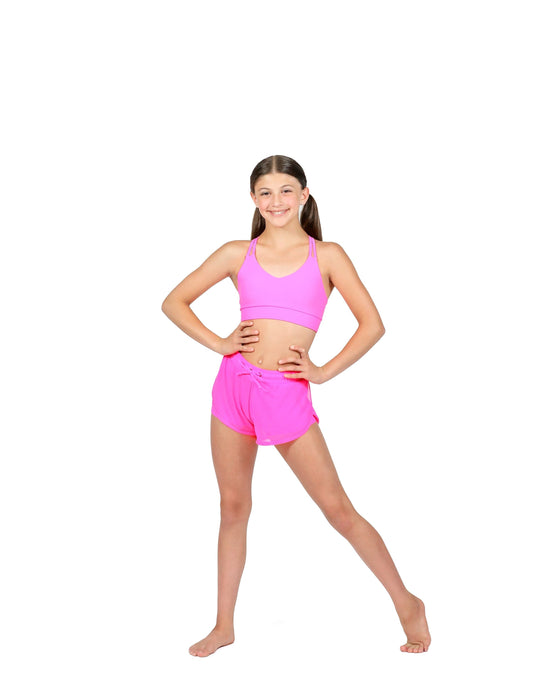 Person wearing a pink sports outfit on a white background