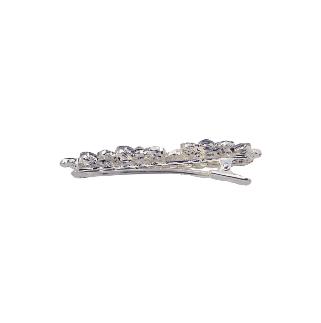 Silver hair clip with clear stones on a white background