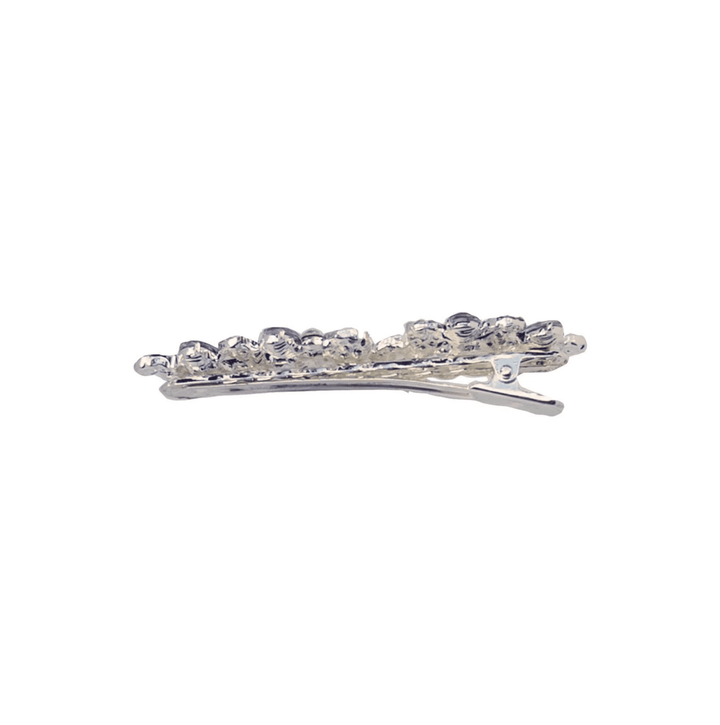 Silver hair clip with clear stones on a white background