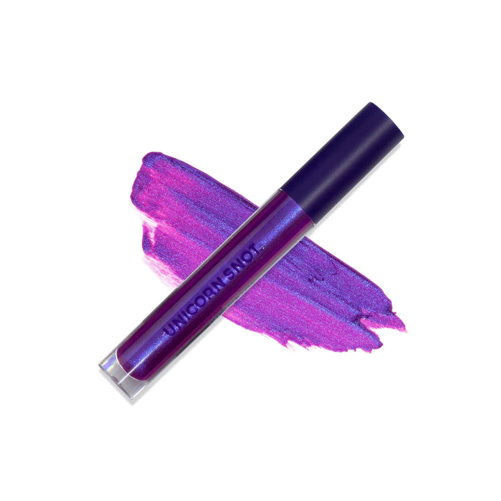 Purple lip gloss on white background