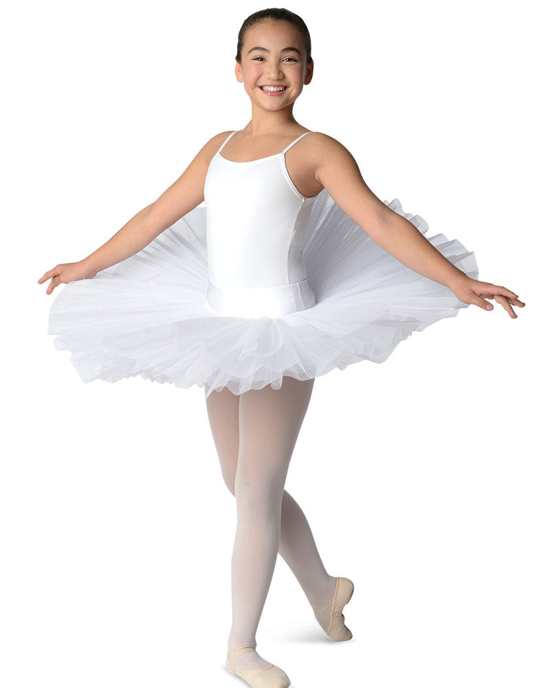 Ballerina in a white tutu posing on a white background