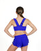 Person wearing a blue sports bra and shorts set on a white background
