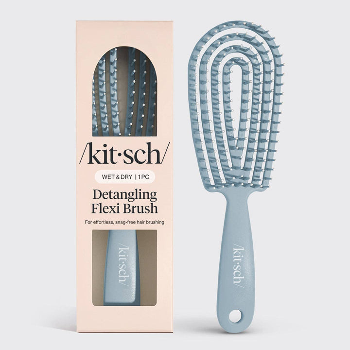 Detangling flexi brush with packaging on a white background