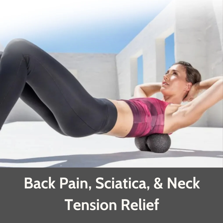 Woman using a foam roller for back pain relief on a rooftop.