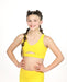 Young girl wearing a yellow sports bra and leggings on a white background