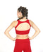 Person wearing a red sports bra and leggings on a white background