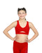 Young girl wearing a red sports bra and leggings on a white background