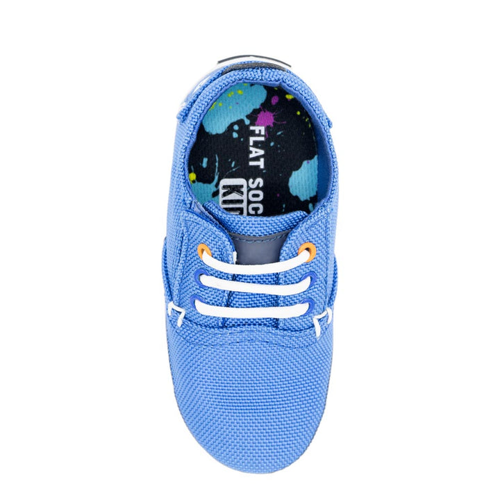 Blue sneaker with white laces on a white background