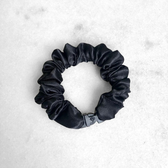 Black scrunchie on a white background