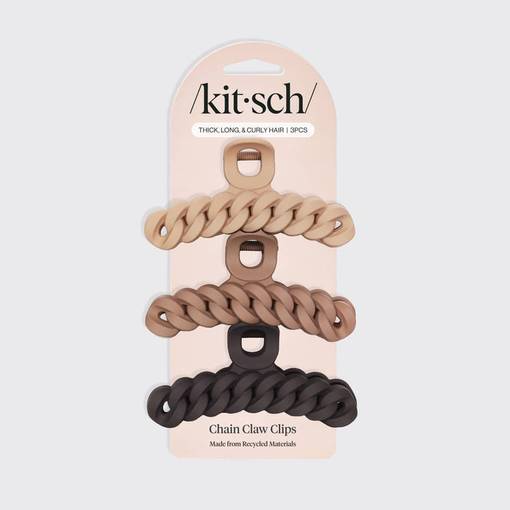 Packaged chain claw clips with 'kitsch' branding on a light gray background
