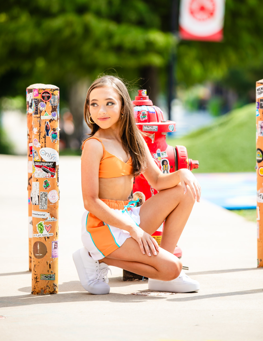Girl posing in front of a fire hydrant in dance shorts