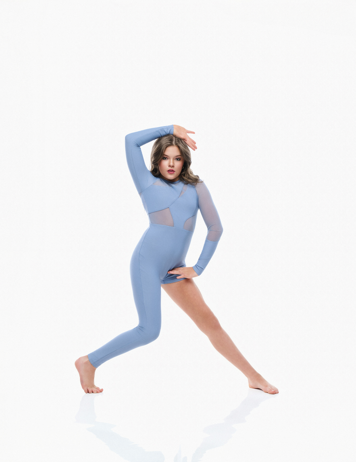 Woman wearing a blue bodysuit on a white background