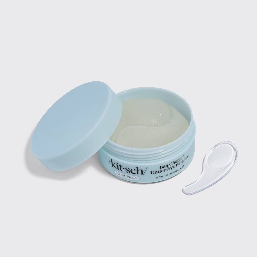 Kit-sch eye patch container with a spoon on a light gray background