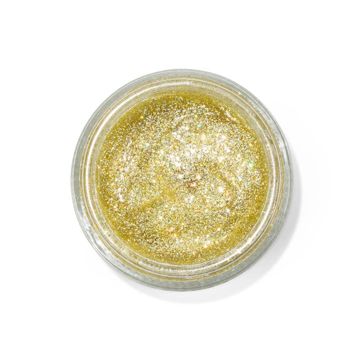 Jar of gold glitter on a white background