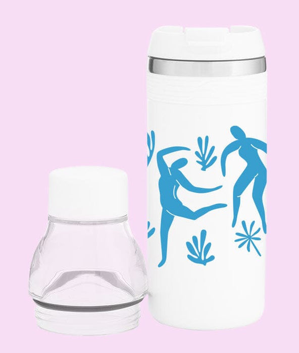 White tumbler with blue abstract designs on a pink background