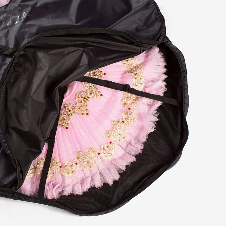 Pink ballet skirt with gold embroidery inside a black storage bag on a white background