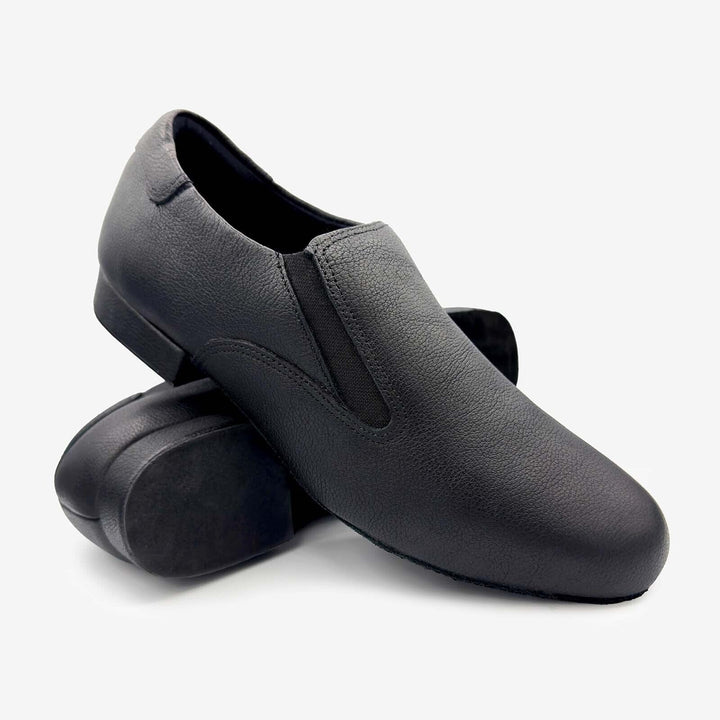 Pair of black slip-on shoes on a white background