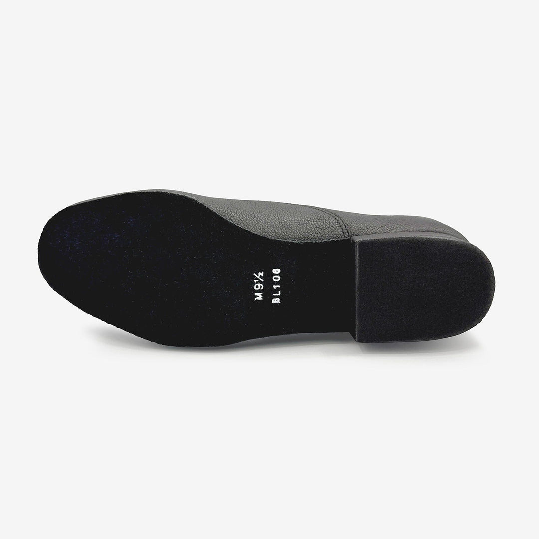 Black shoe sole with brand name on a white background