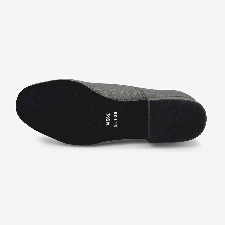 Black shoe sole with brand name on a white background