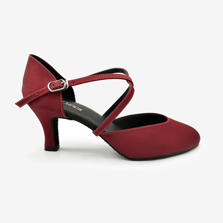Red dance shoe with a strap on a white background