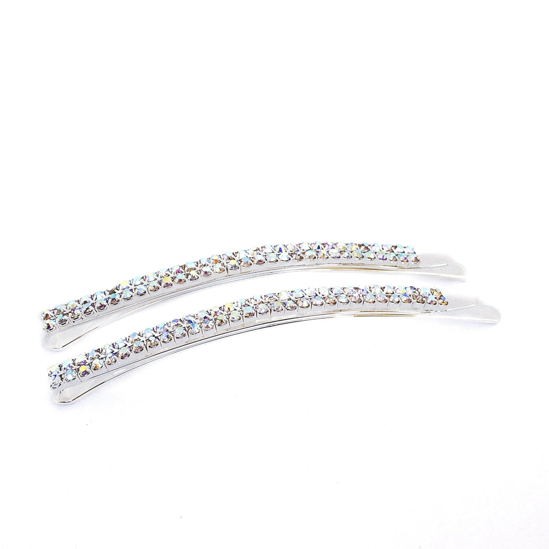 Two silver hair clips with crystal stones on a white background