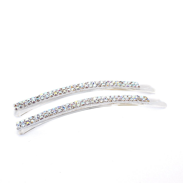 Two silver hair clips with crystal stones on a white background