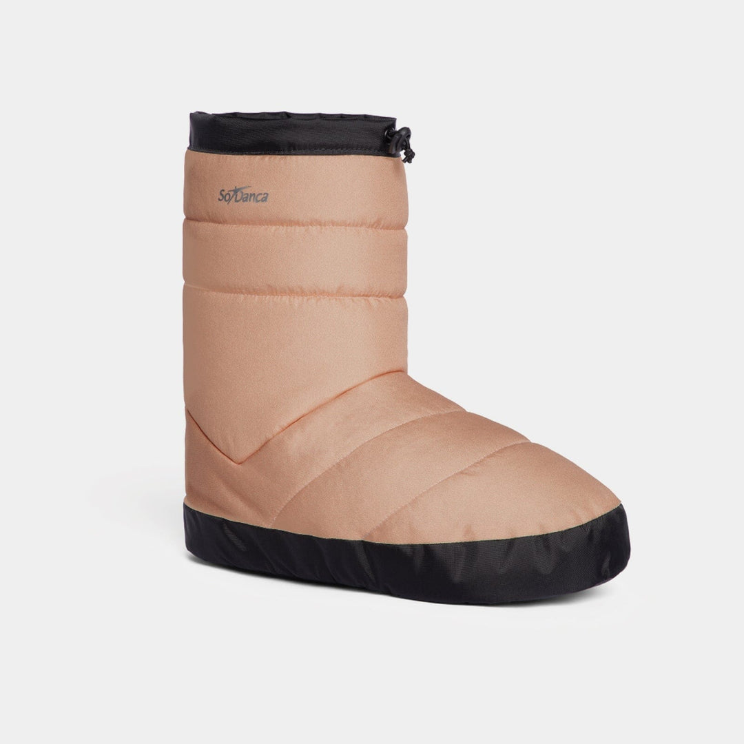 Beige winter boot with black sole on a white background