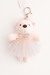 Pink teddy bear keychain with a tutu and sequin belt on a white background