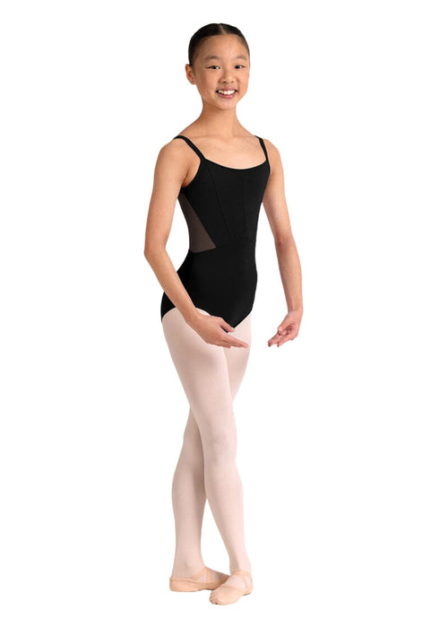 Young girl wearing a black leotard and pink tights on a white background
