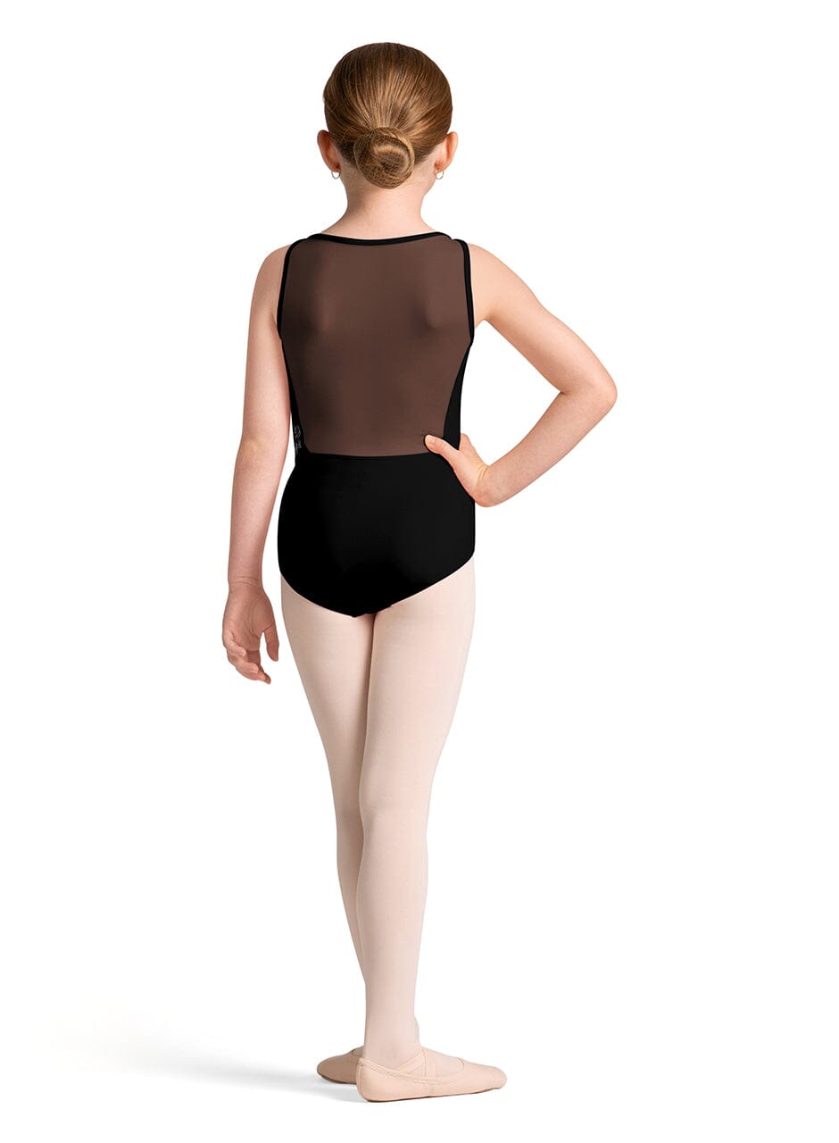 Ballet dancer wearing a black leotard and beige tights on a white background