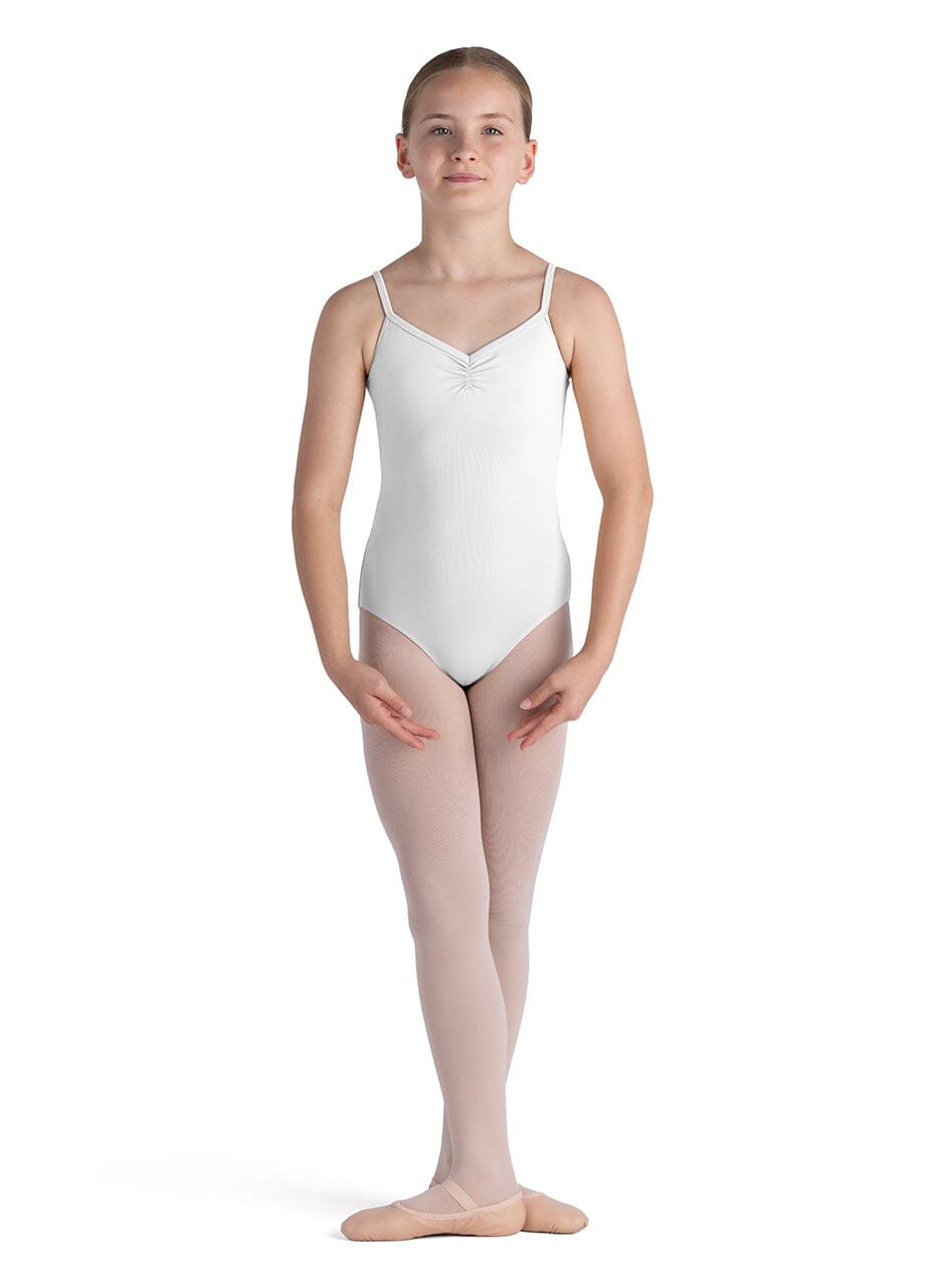 Young dancer wearing a white leotard and pink tights on a white background