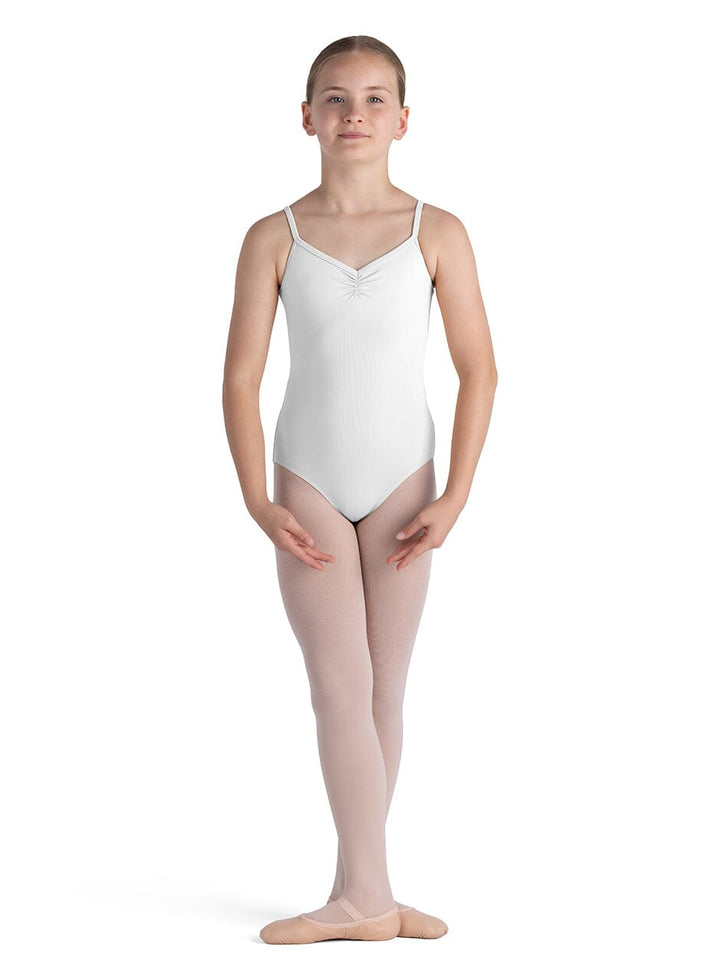 Young dancer wearing a white leotard and pink tights on a white background