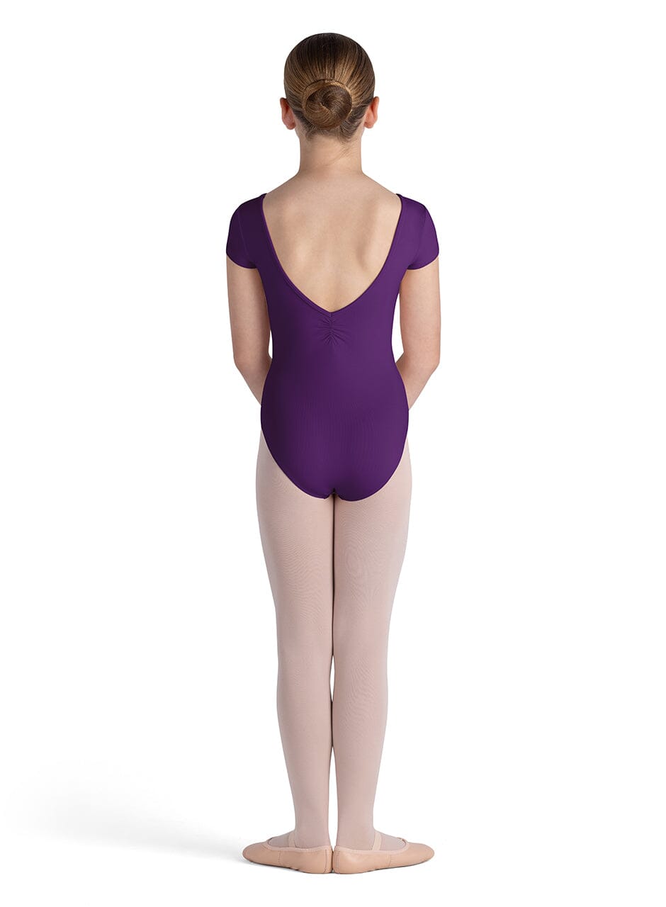 Person wearing a purple leotard on a white background