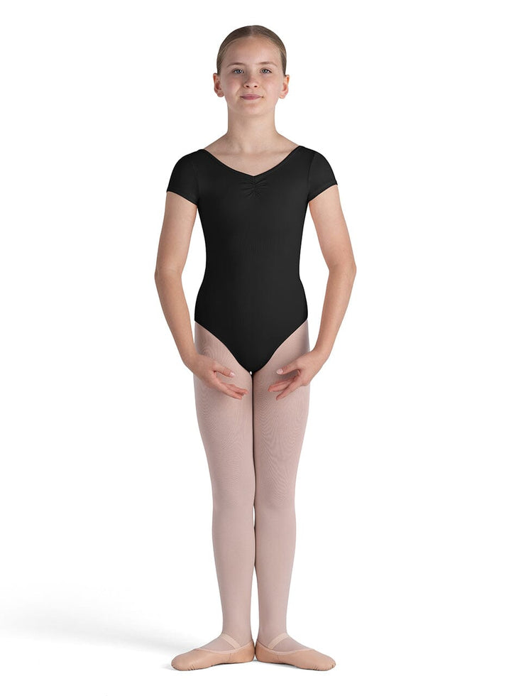 Person wearing a black leotard and pink tights on a white background