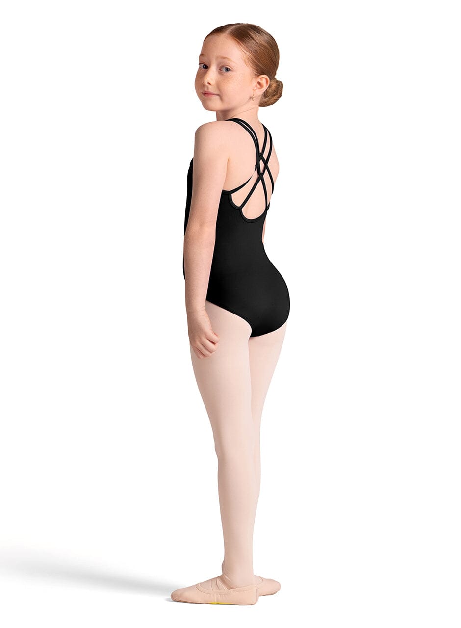 Young girl in a black leotard posing on a white background