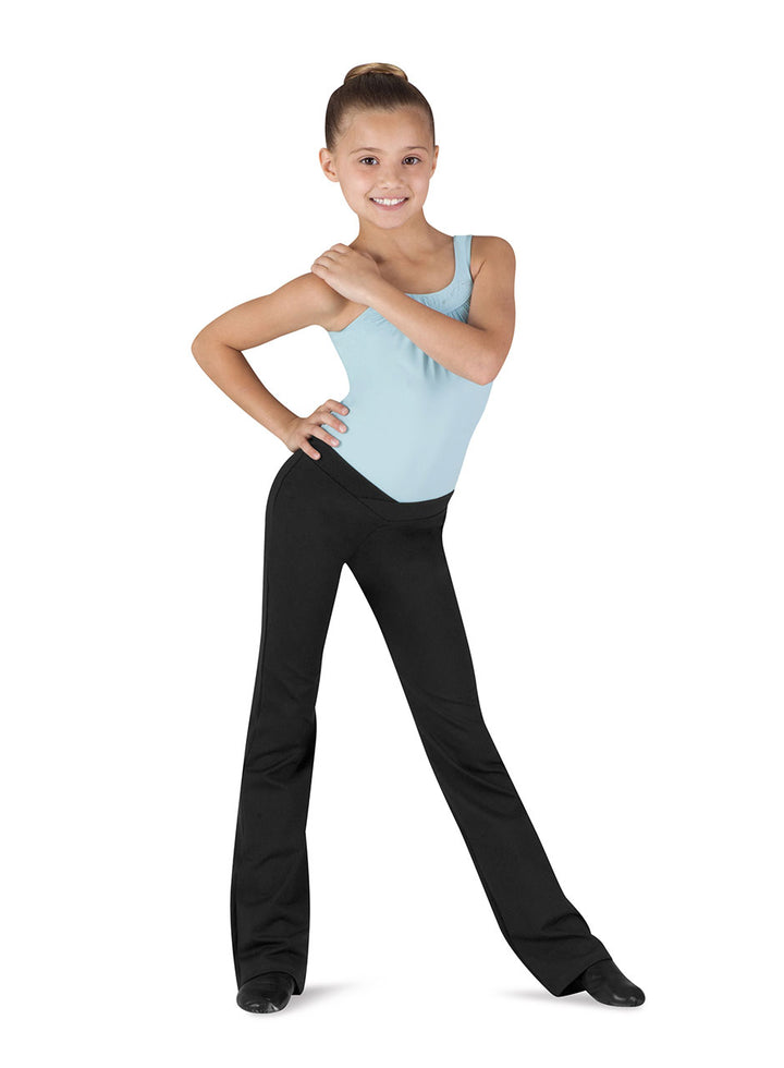 Dancer in a light blue top and black pants on a white background
