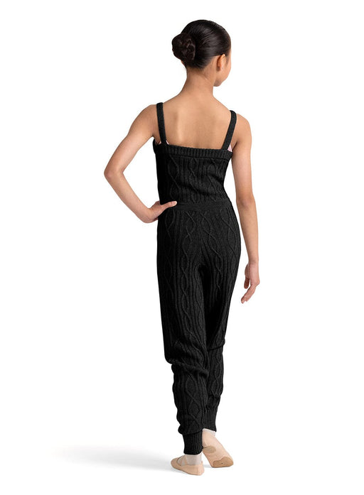 Woman wearing a black jumpsuit on a white background