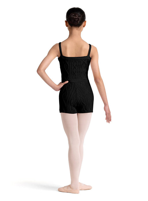 Ballerina in a black leotard and pink tights on a white background