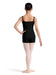 Ballerina in a black leotard and pink tights on a white background