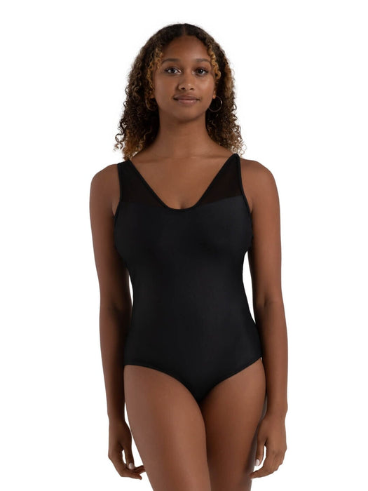 Woman wearing a black swimsuit against a white background