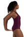 Woman wearing a purple swimsuit against a white background
