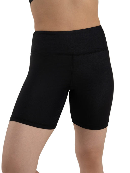 Black athletic shorts worn by a person on a white background
