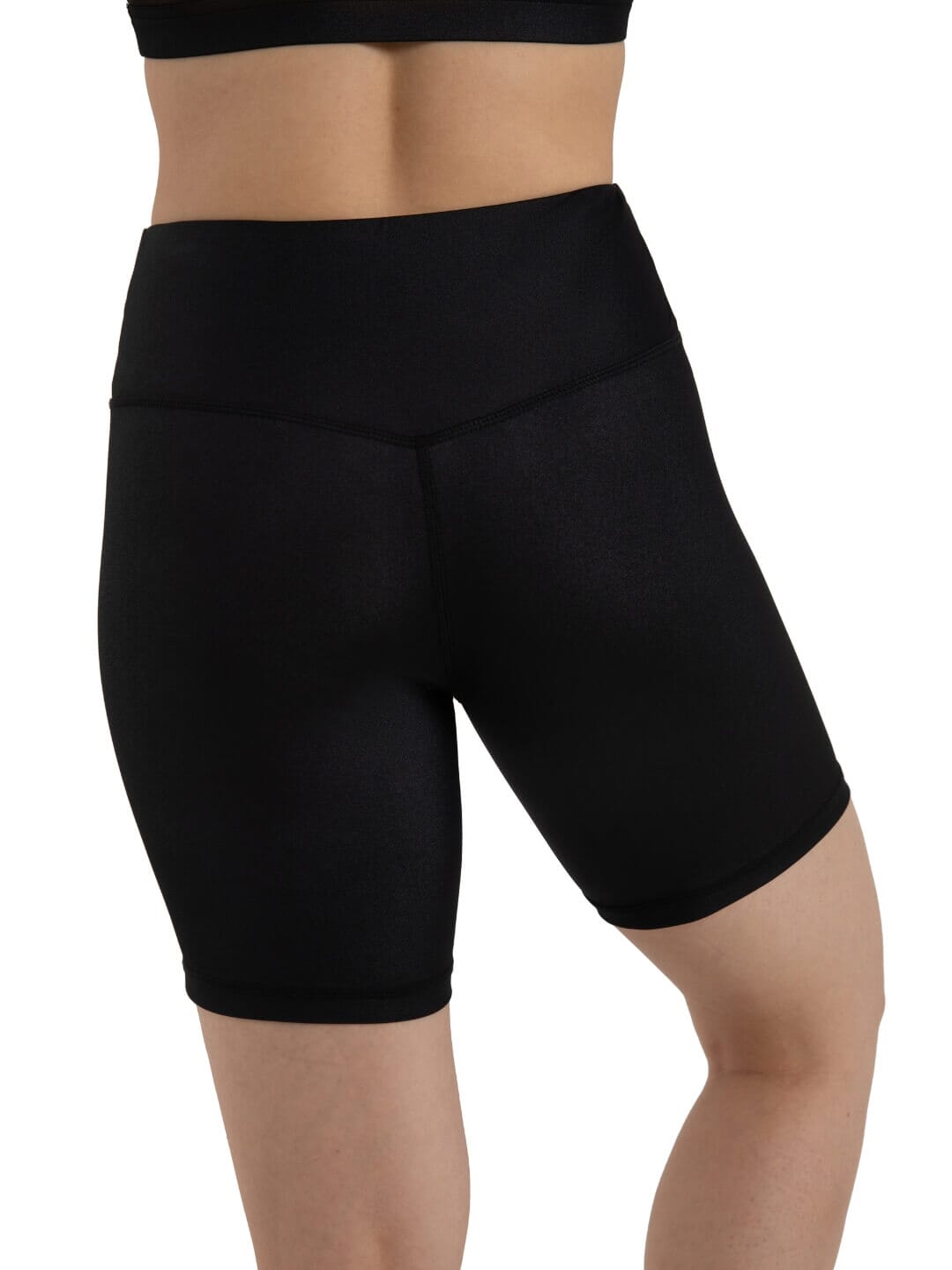 Black athletic shorts worn by a person on a white background